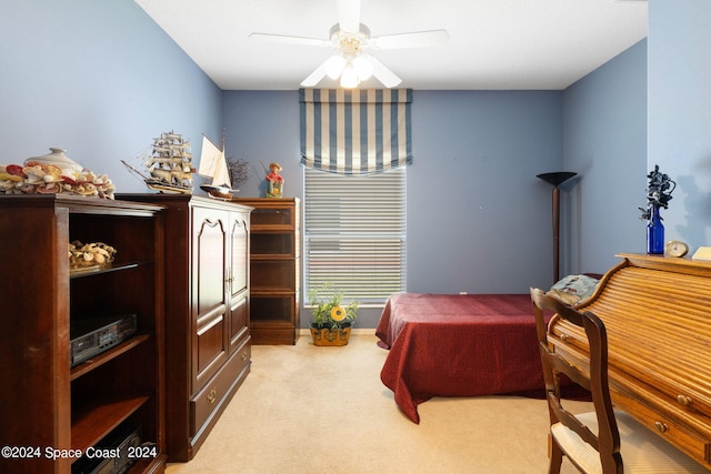 bedroom featuring light carpet and ceiling fan