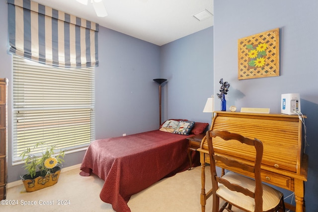 bedroom with ceiling fan and carpet flooring