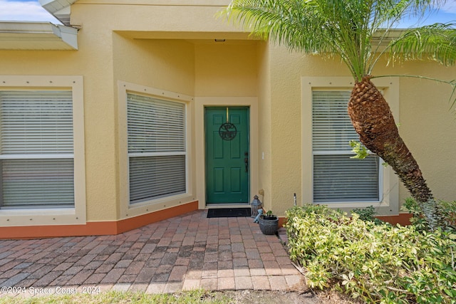 property entrance with a patio