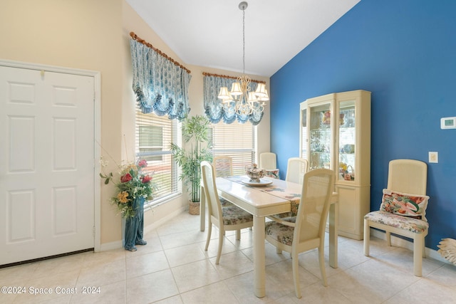 tiled dining area featuring a notable chandelier, lofted ceiling, and a healthy amount of sunlight