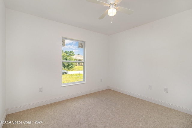 unfurnished room with carpet floors and ceiling fan