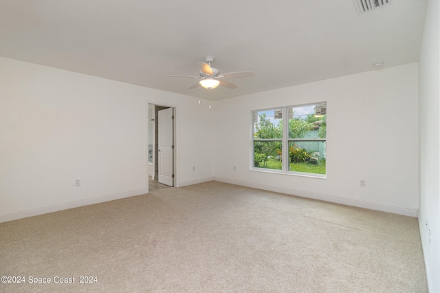 carpeted empty room with ceiling fan