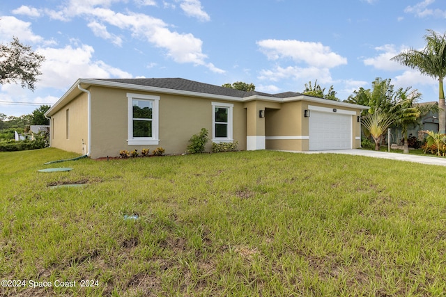 ranch-style house featuring a garage and a front lawn