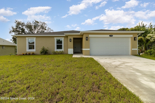 single story home featuring a front yard and a garage