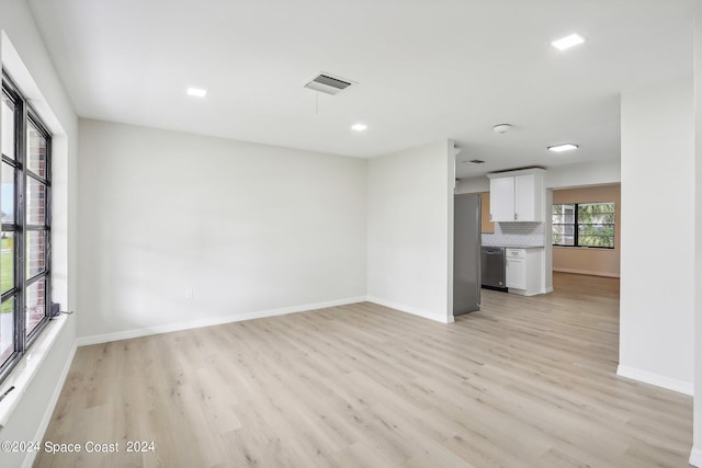 unfurnished living room featuring light wood-type flooring