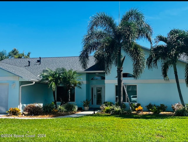 ranch-style house with a front lawn and a garage