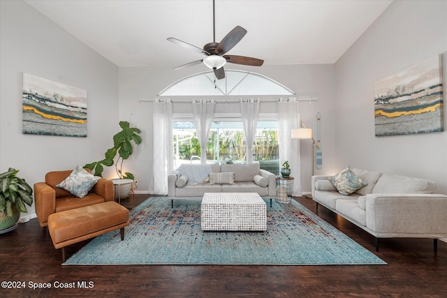 living room with ceiling fan and dark hardwood / wood-style flooring