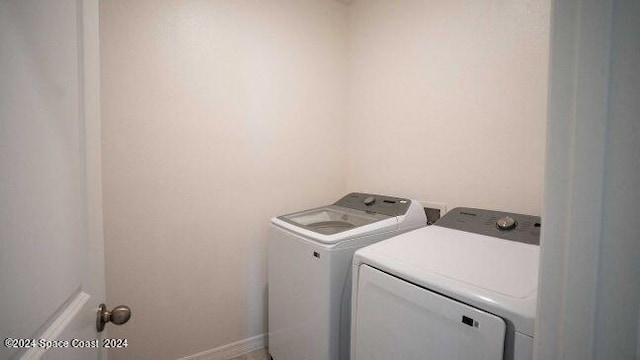 laundry room with separate washer and dryer