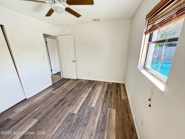 unfurnished bedroom featuring wood-type flooring and ceiling fan