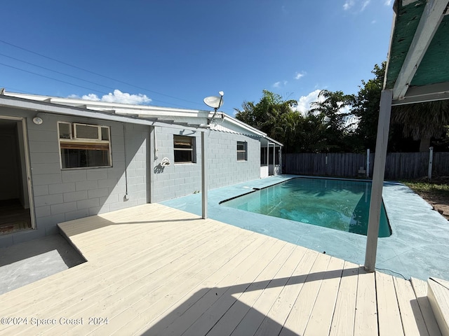 view of swimming pool featuring a wooden deck