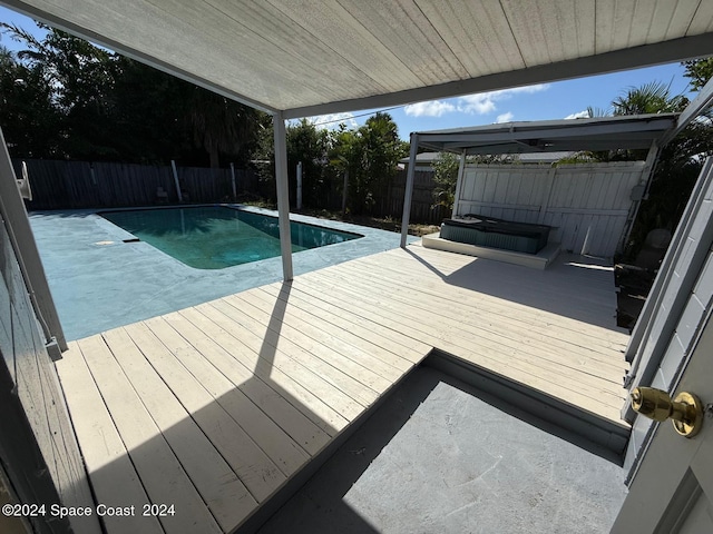 view of pool with a wooden deck