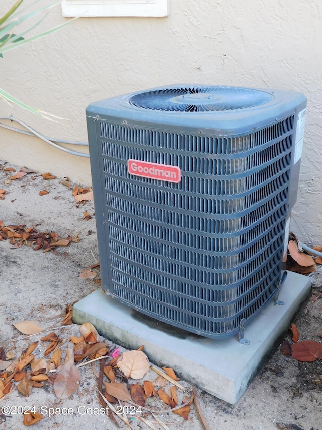 exterior details with stucco siding and central air condition unit