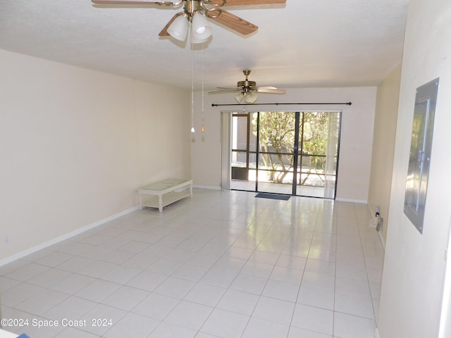 tiled empty room with ceiling fan