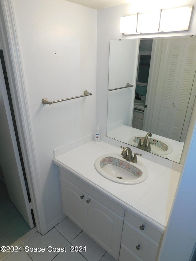 bathroom with vanity and tile patterned floors