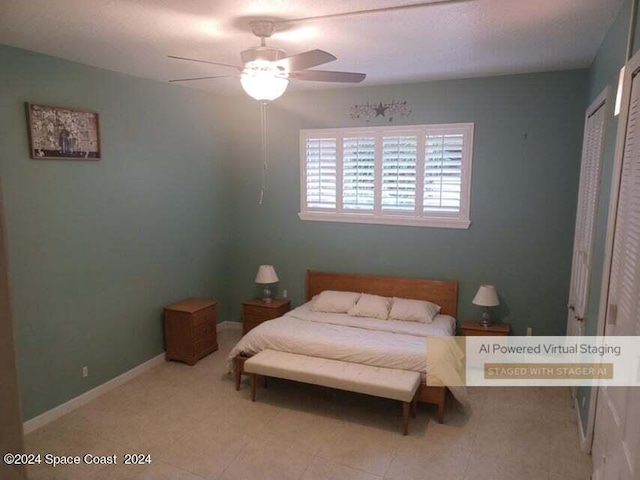 bedroom featuring ceiling fan, baseboards, and tile patterned flooring