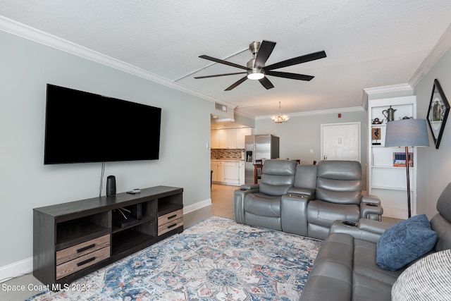 tiled living room with ornamental molding, a textured ceiling, and ceiling fan with notable chandelier