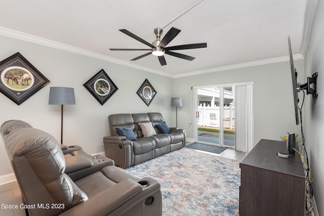 living room featuring crown molding, a textured ceiling, and ceiling fan