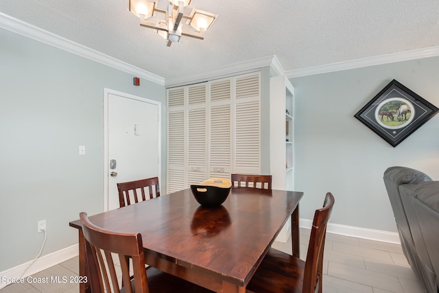 dining space with crown molding, a textured ceiling, a chandelier, and light tile patterned floors