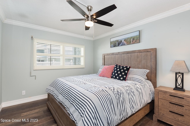 bedroom featuring ornamental molding, a textured ceiling, dark wood-type flooring, and ceiling fan