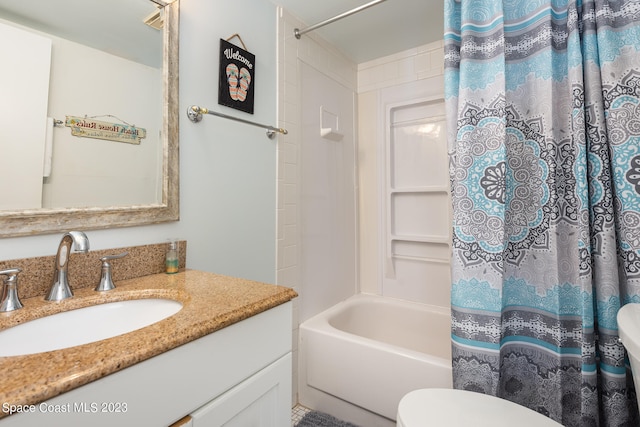 full bathroom with toilet, shower / bath combo with shower curtain, and vanity