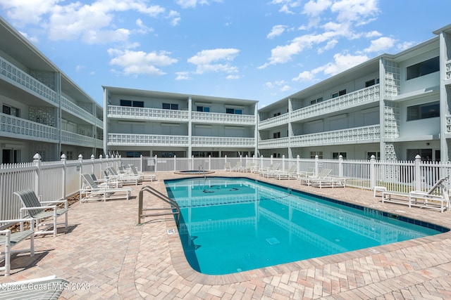 view of swimming pool with a patio area