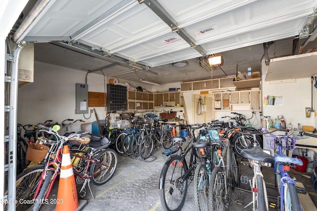 garage featuring electric panel and a garage door opener