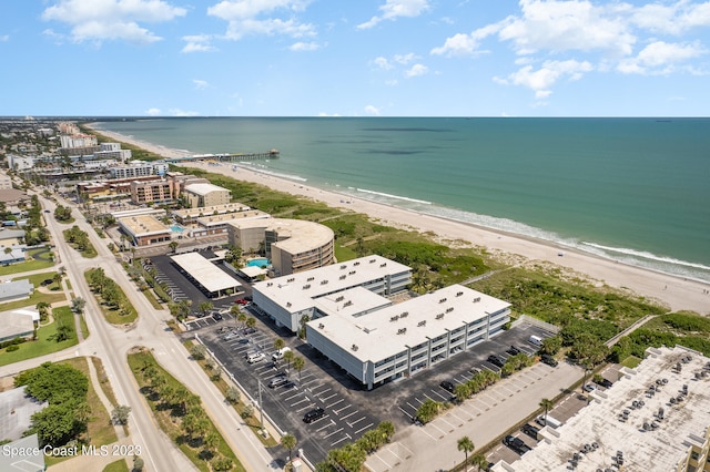 birds eye view of property featuring a view of the beach and a water view