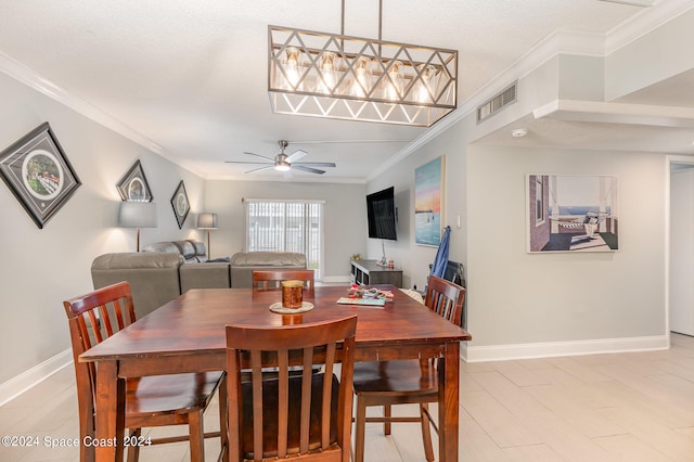 dining room with ornamental molding, a textured ceiling, and ceiling fan