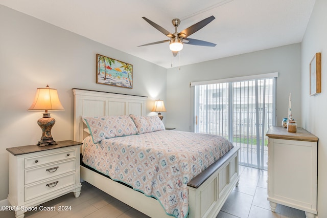 bedroom with ceiling fan, light tile patterned floors, and access to exterior