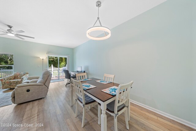 dining area with ceiling fan and light hardwood / wood-style flooring