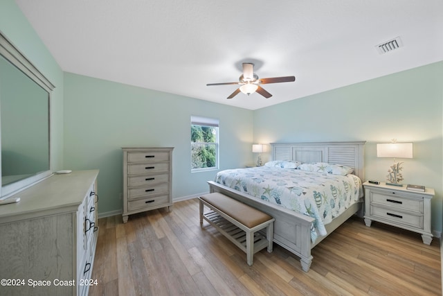 bedroom featuring light hardwood / wood-style floors and ceiling fan