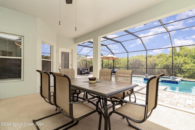 929 Hialeah St, Rockledge, FL 32955 - view of patio / terrace with outdoor dining space, a pool with connected hot tub, and a lanai