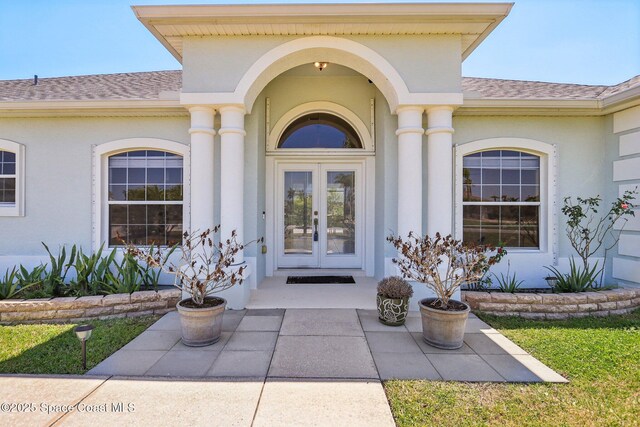 929 Hialeah St, Rockledge, FL 32955 - property entrance with roof with shingles, french doors, and stucco siding