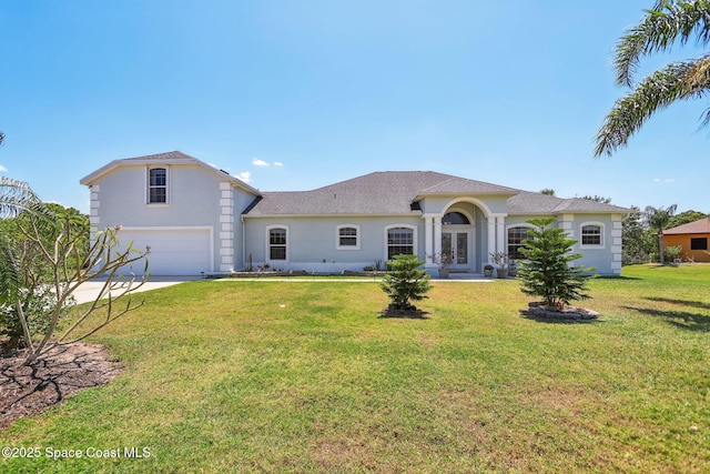 929 Hialeah St, Rockledge, FL 32955 - view of front of house featuring stucco siding, roof with shingles, a front yard, an attached garage, and concrete driveway