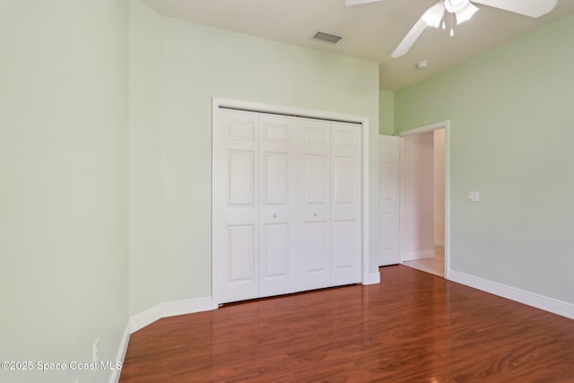 929 Hialeah St, Rockledge, FL 32955 - unfurnished bedroom with visible vents, a closet, baseboards, and wood finished floors