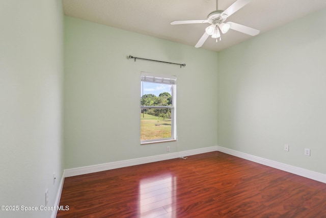 929 Hialeah St, Rockledge, FL 32955 - spare room featuring baseboards, a ceiling fan, and dark wood finished floors