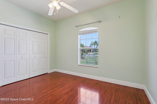 929 Hialeah St, Rockledge, FL 32955 - unfurnished bedroom with a closet, baseboards, and wood finished floors