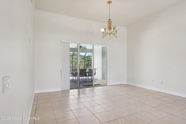 929 Hialeah St, Rockledge, FL 32955 - spare room featuring a chandelier, a towering ceiling, baseboards, and light tile patterned flooring
