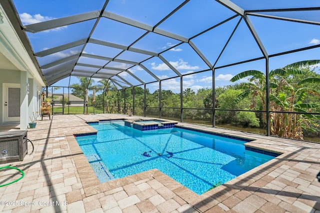 929 Hialeah St, Rockledge, FL 32955 - view of swimming pool with a lanai, a patio area, and a pool with connected hot tub
