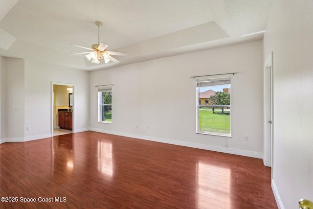 929 Hialeah St, Rockledge, FL 32955 - spare room with wood finished floors, baseboards, a ceiling fan, and plenty of natural light