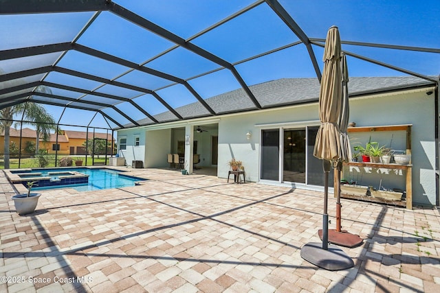 929 Hialeah St, Rockledge, FL 32955 - view of swimming pool with a pool with connected hot tub, glass enclosure, a patio, and a ceiling fan