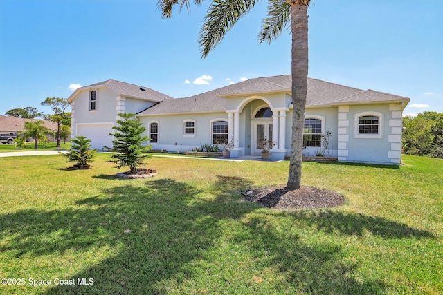 929 Hialeah St, Rockledge, FL 32955 - view of front of home with a front yard, driveway, stucco siding, and an attached garage