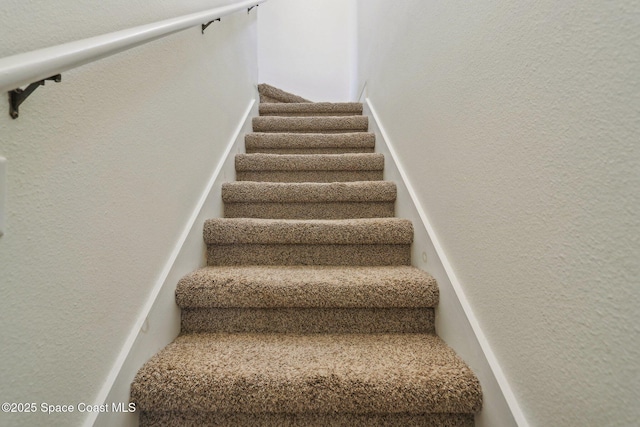 929 Hialeah St, Rockledge, FL 32955 - stairs with a textured wall