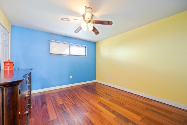 empty room featuring wood-type flooring and ceiling fan