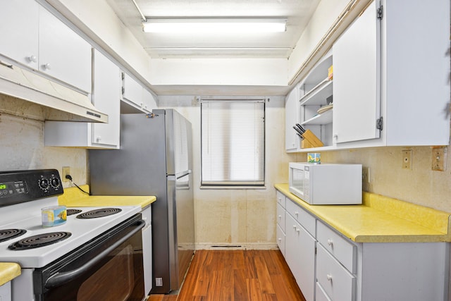 kitchen featuring white appliances, dark wood-type flooring, and white cabinets