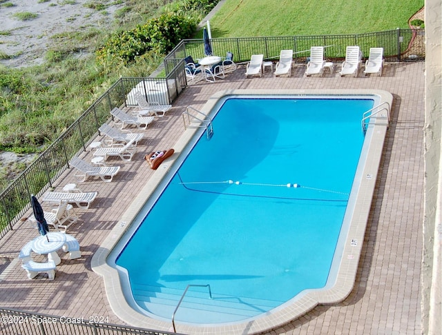 view of swimming pool featuring a patio