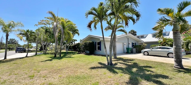 view of property exterior featuring a garage and a yard