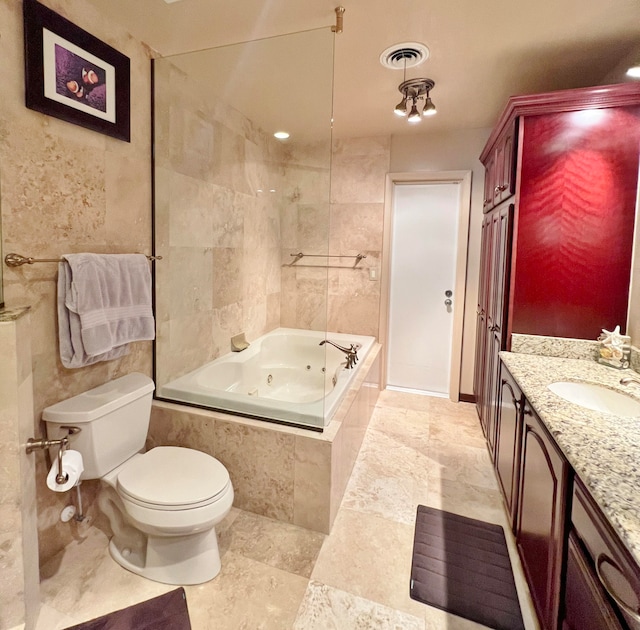 bathroom featuring tile walls, vanity, and toilet