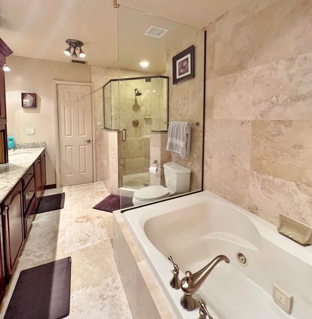 full bathroom featuring vanity, shower with separate bathtub, and toilet