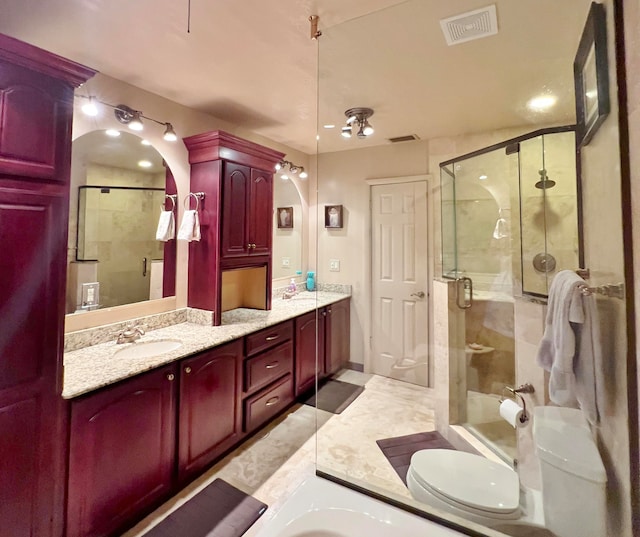 full bathroom featuring shower with separate bathtub, vanity, and toilet